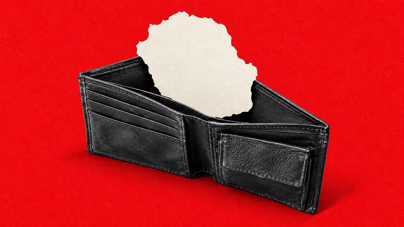 Portefeuille noir presque vide contenant une silhouette blanche stylisée de La Réunion, sur fond rouge texturé.